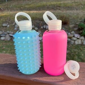 2 BKR 16 oz glass bottles with sheer sleeve hot pink
Baby and light blue Sky